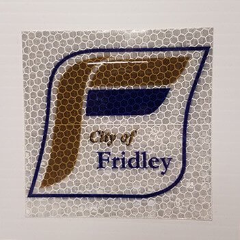 Close-up of a custom high intensity prismatic reflective vinyl decal with honeycomb reflective pattern.