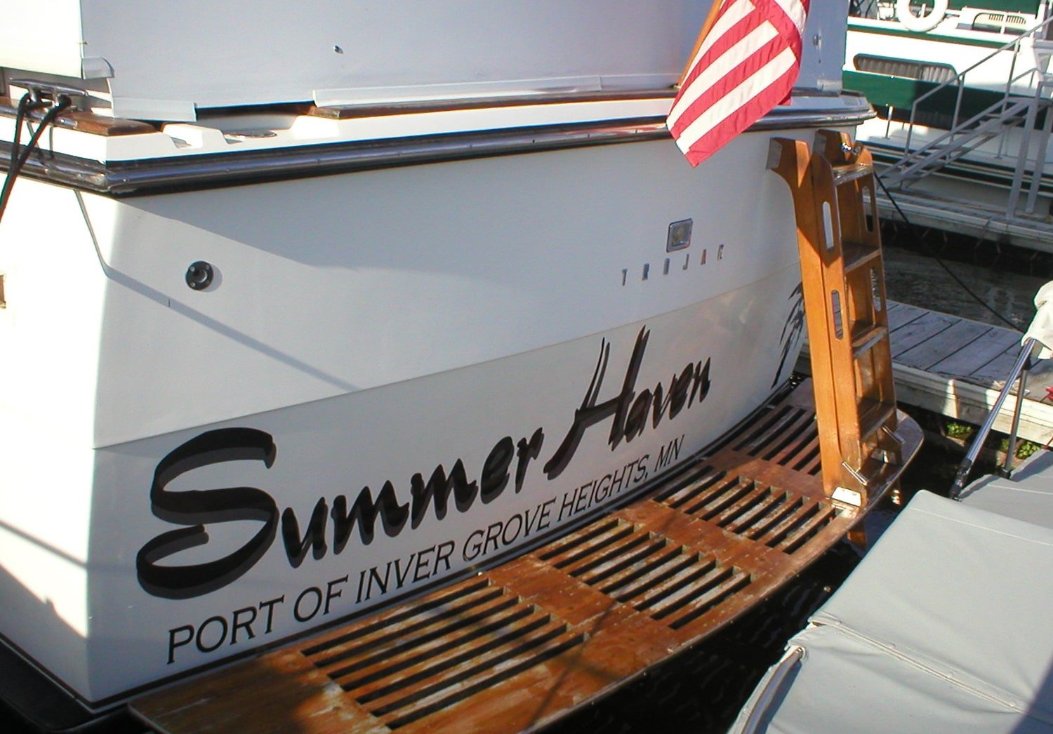 Custom text on the back of a boat. 